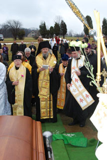 Bishop Melchisedek presides at interment of Archbishop Job on Saturday, December 26, 2009.