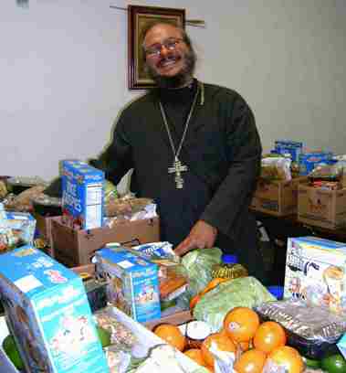 Fr. Antonio Perdomo with donations